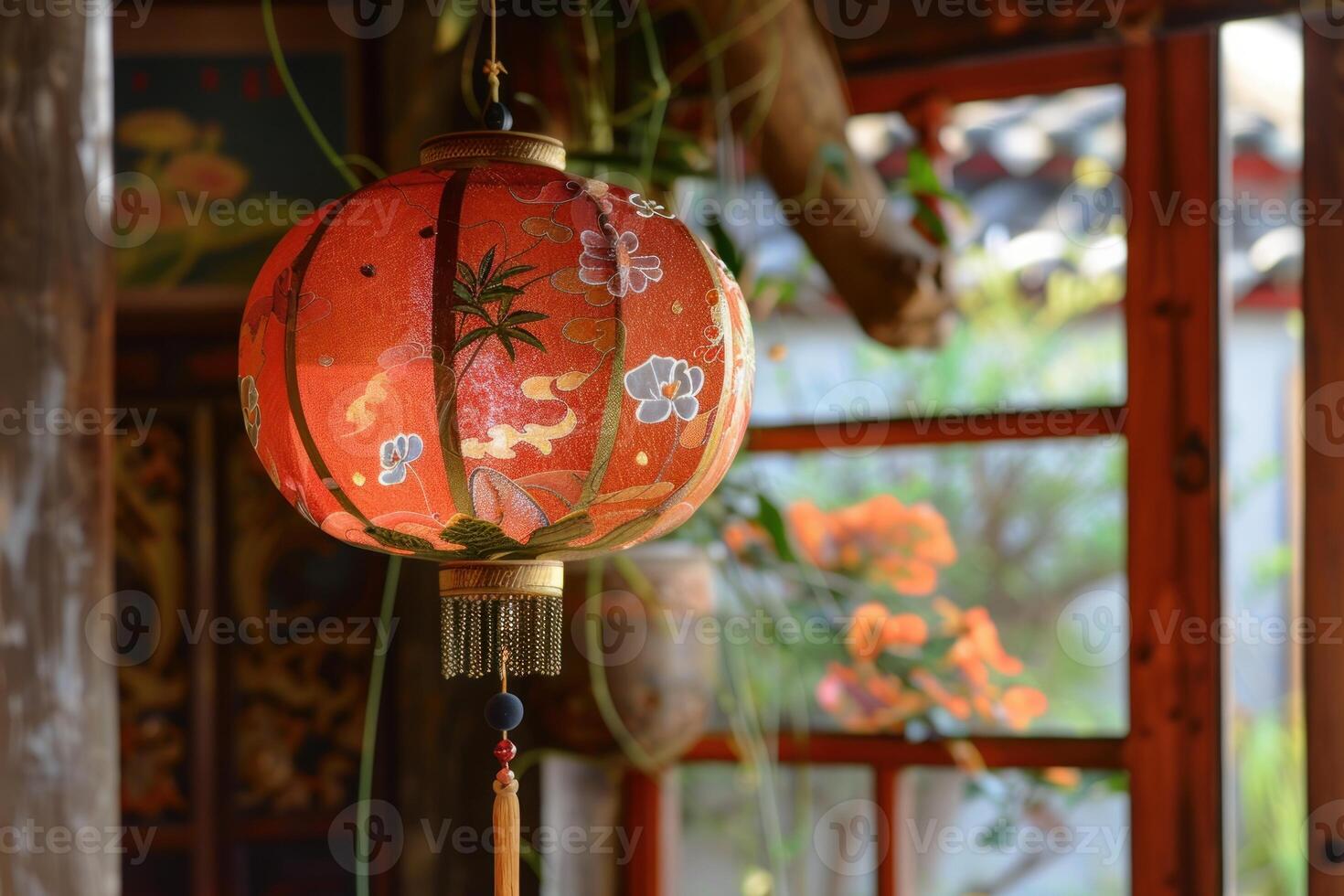 Beautiful red chinese paper lantern hanging in a house photo