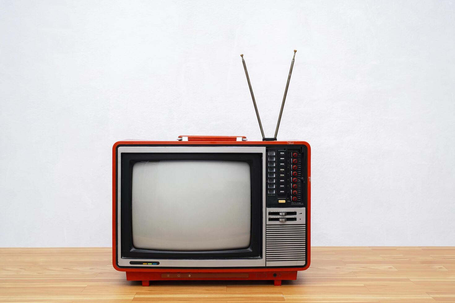 Vintage TV set isolated. Retro television - Old vintage red television, retro technology. Ancient tv concept photo