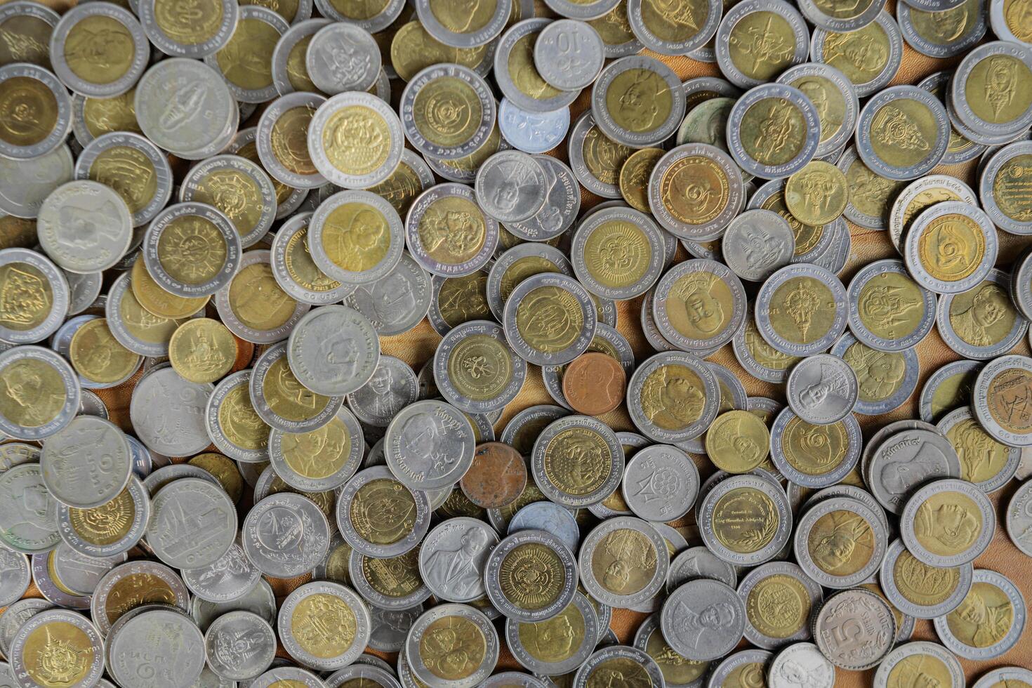 Background coins Thai money on table, Silver and gold Thai baht coins photo