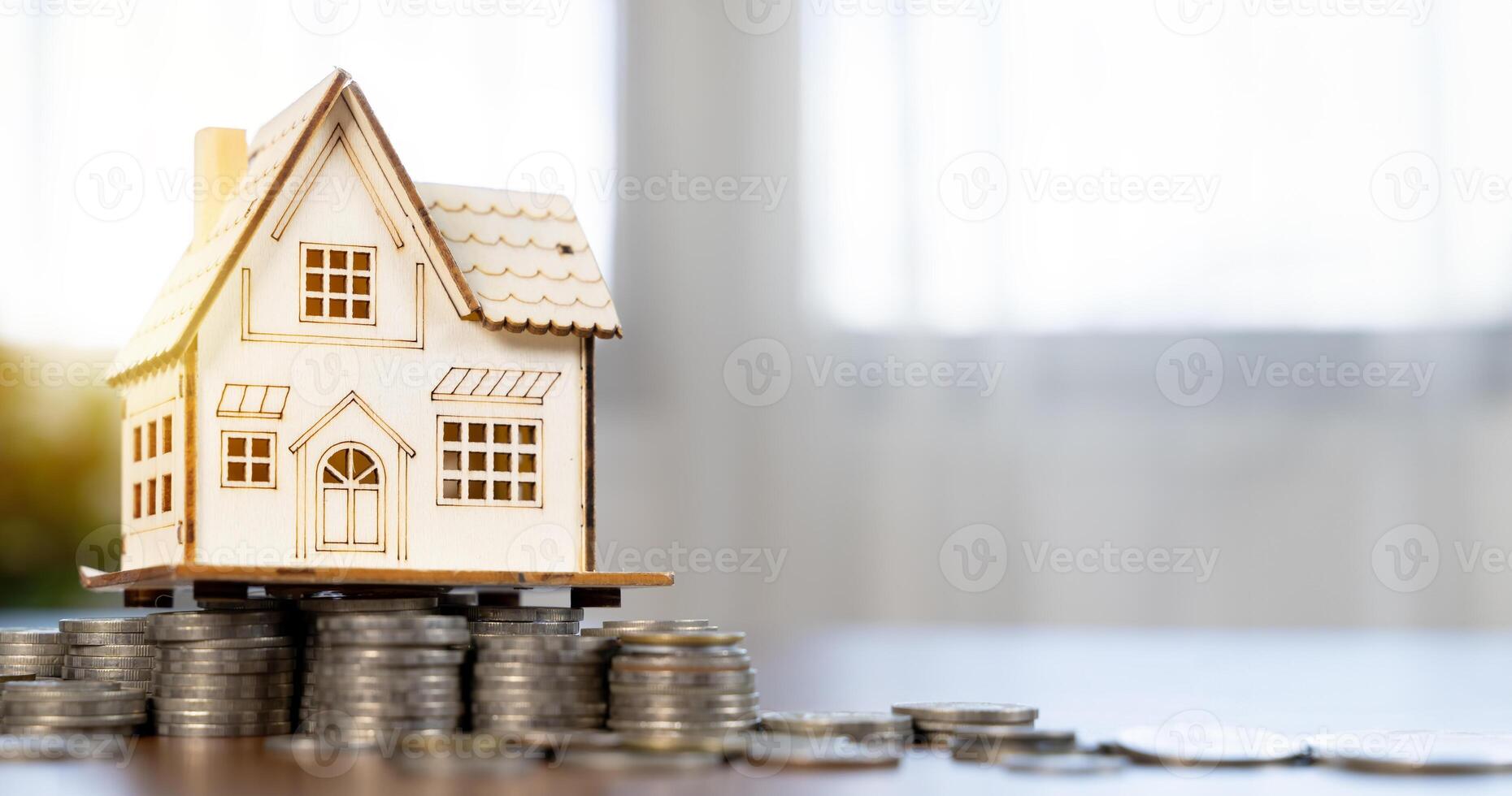 Business income investment and coin stack growth with home technology. Finance and real estate trading. photo