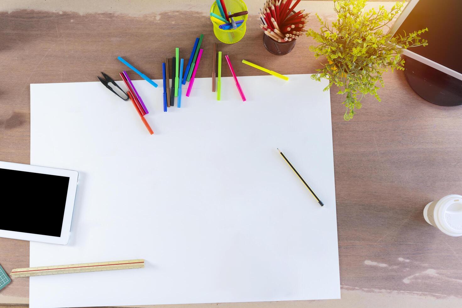 Creative design top view concept. Blank paper with stationery photo