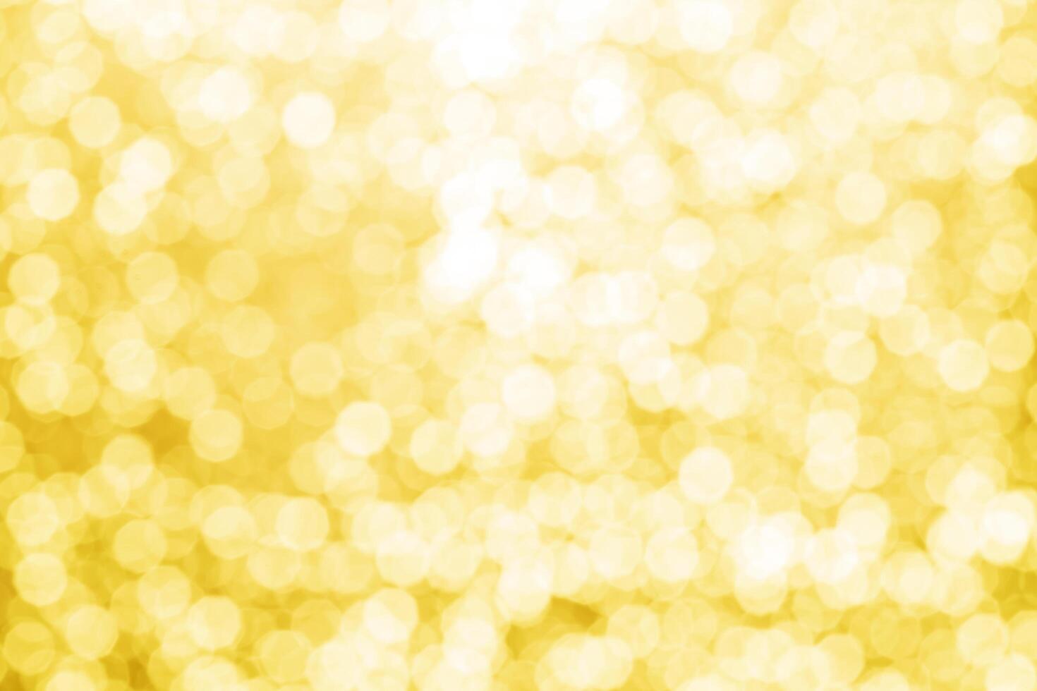 gold abstract background with bokeh defocused lights photo