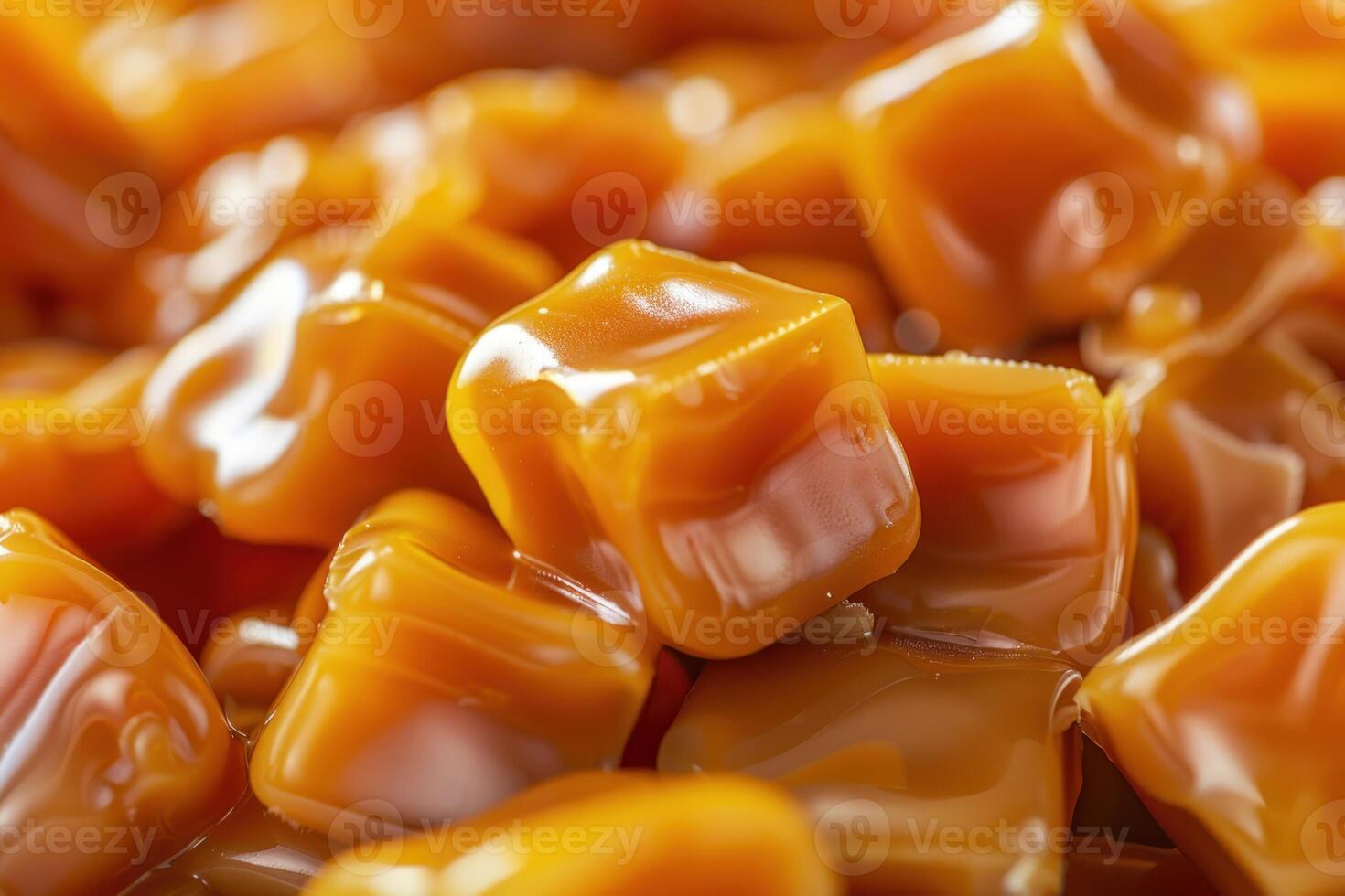 Delicious caramel candies forming sweet background texture photo