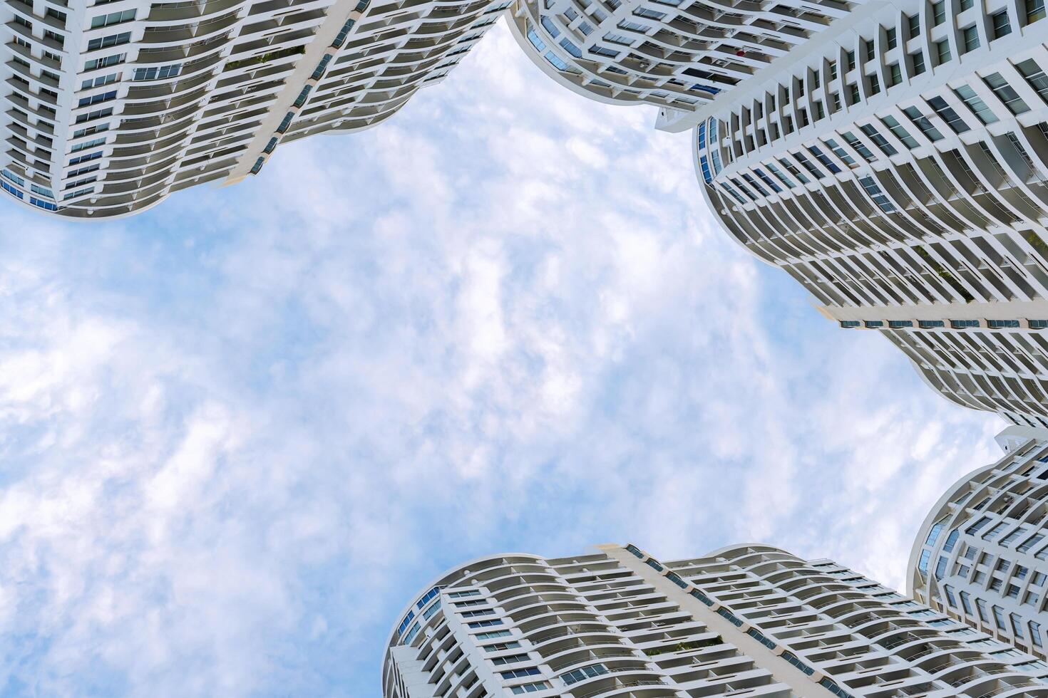 Panoramic and perspective wide angle view to steel blue background of high rise building skyscrapers photo
