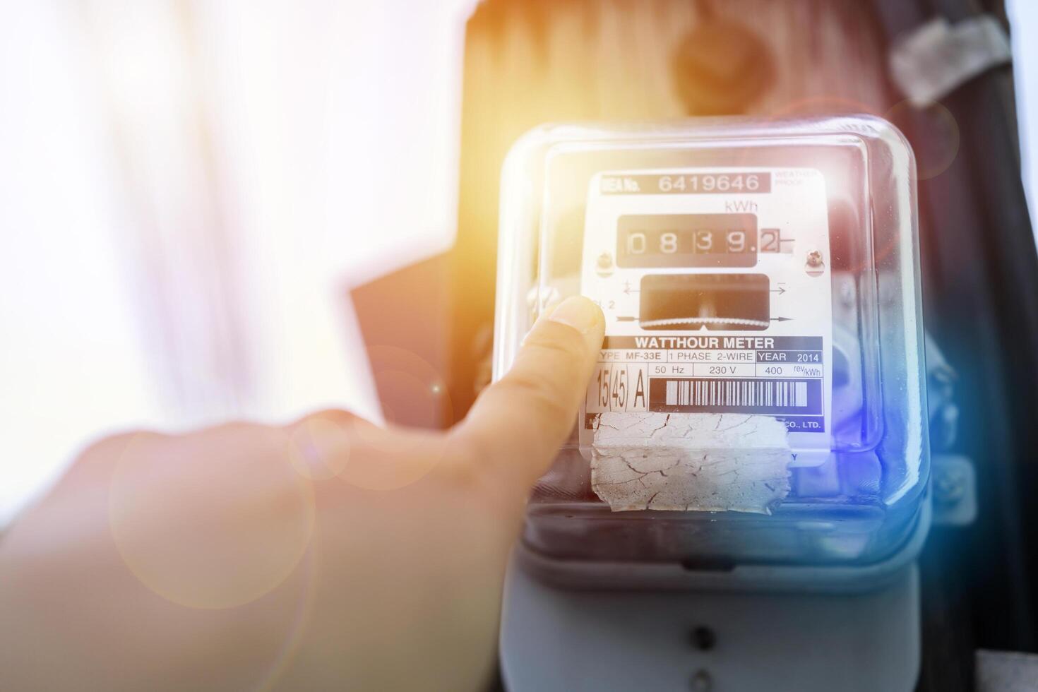 Hand is touching the transformer with copy space photo
