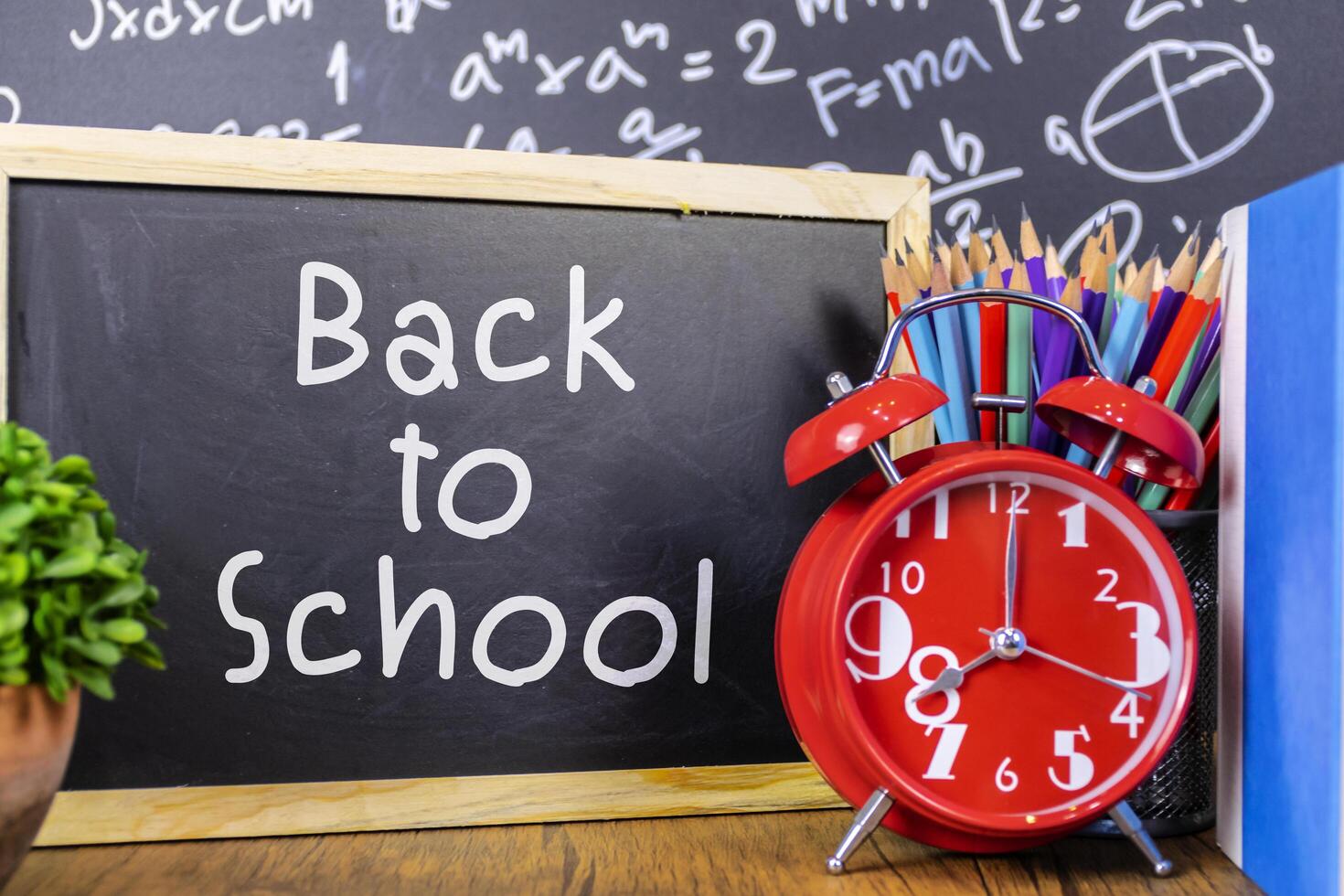 Back to school text drawing by white chalk in blackboard photo