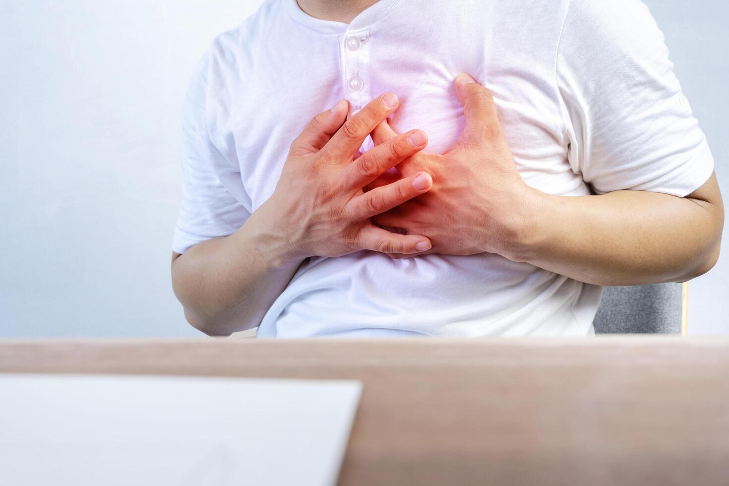 Asian men suffering from acute heart disease photo