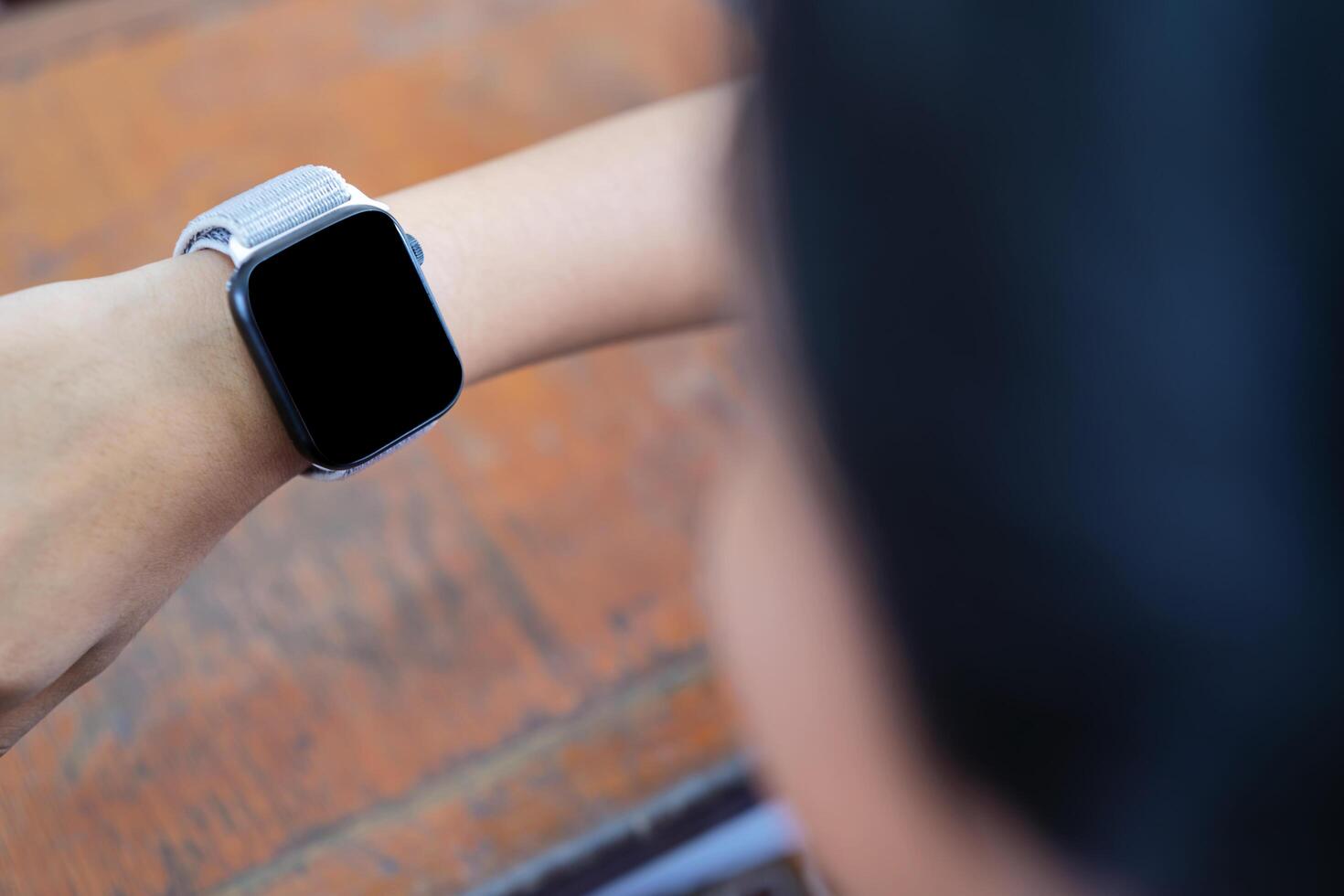 using her smart watch app. Closeup hands photo