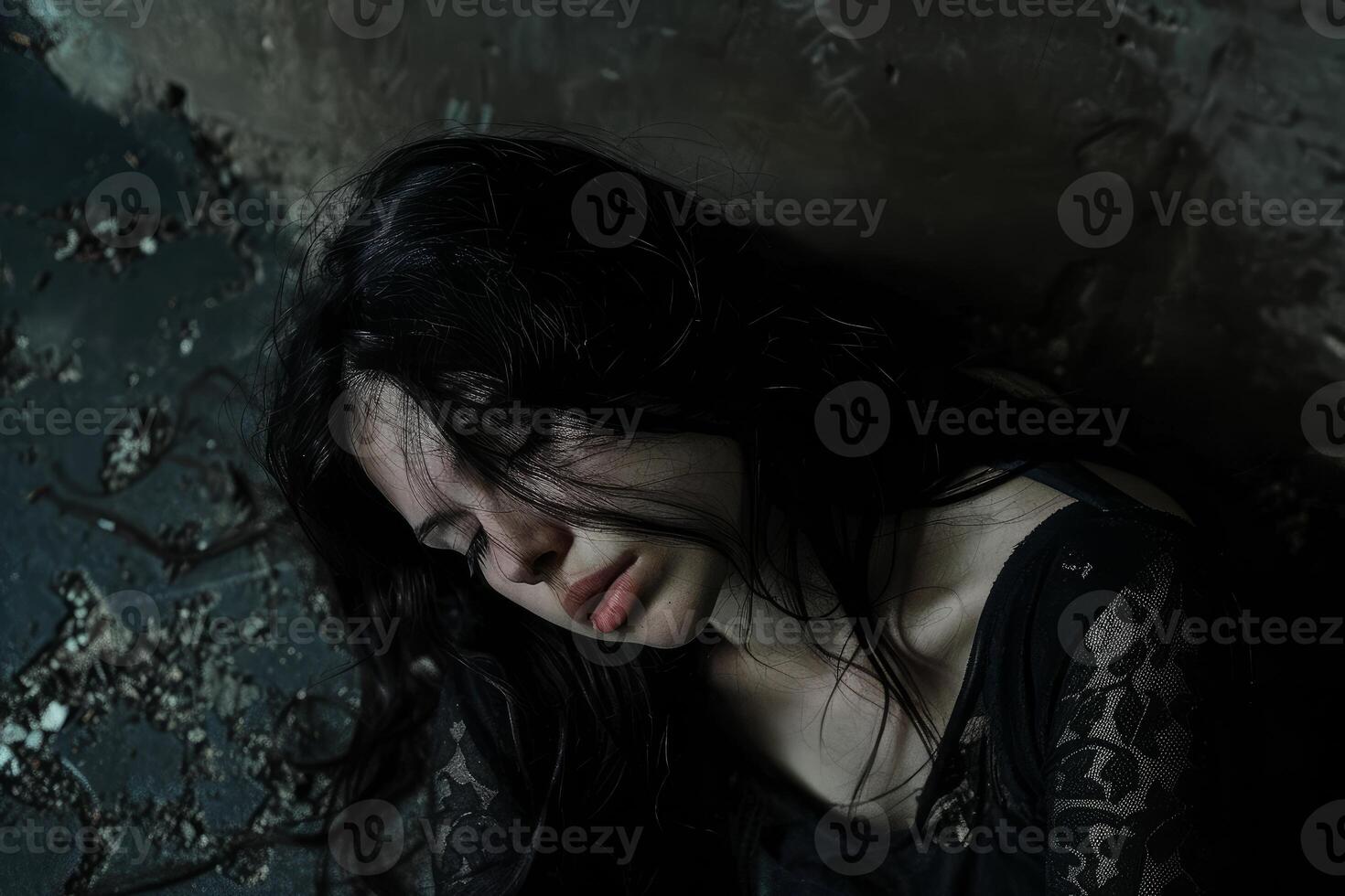 Solitude in shadows, portrait of a pensive woman photo