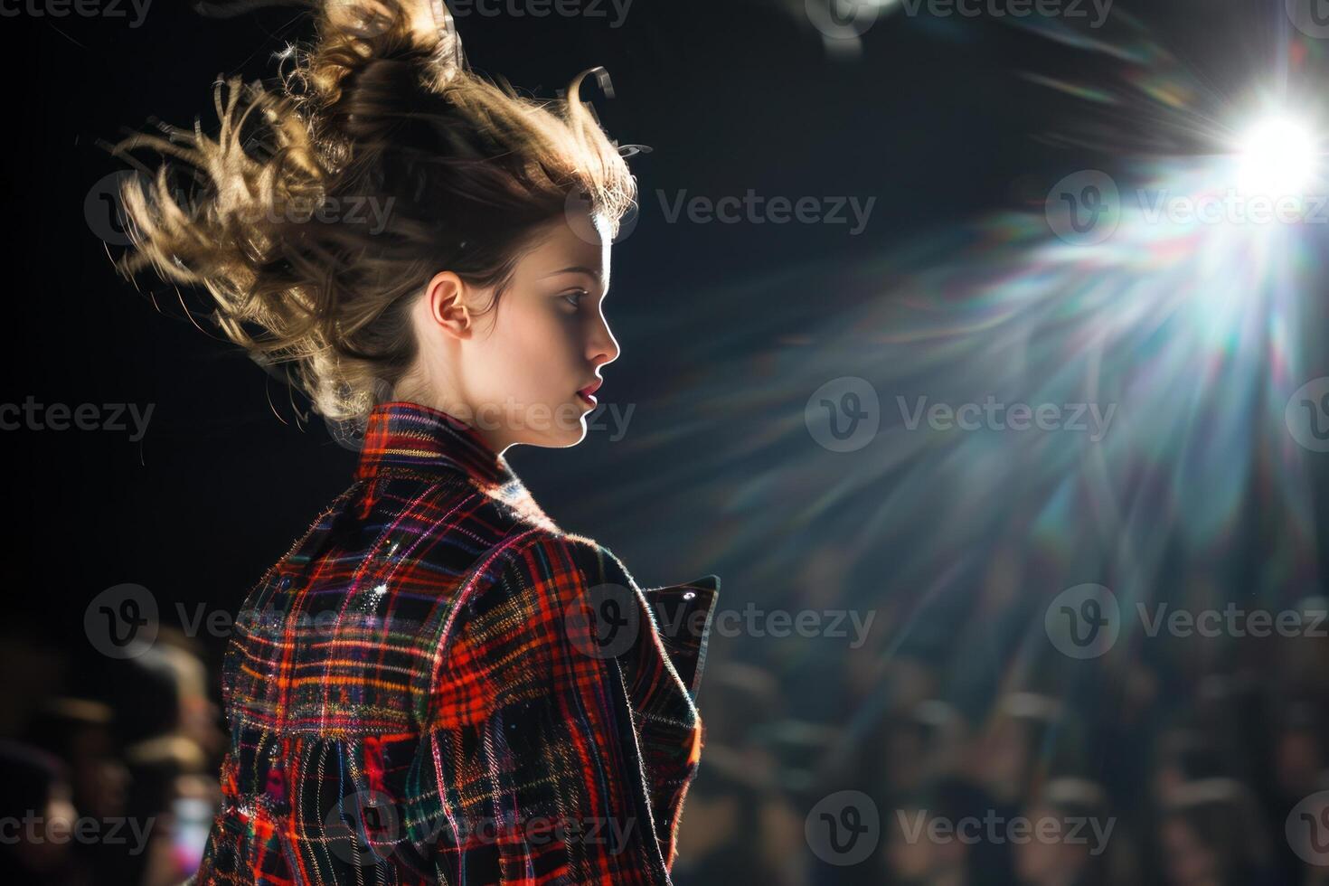 Elegant model in tartan jacket at fashion show photo