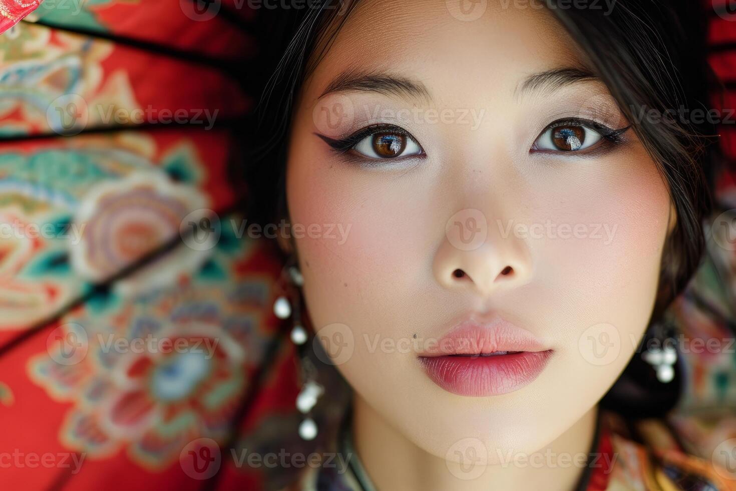 Portrait of a young woman with traditional umbrella photo