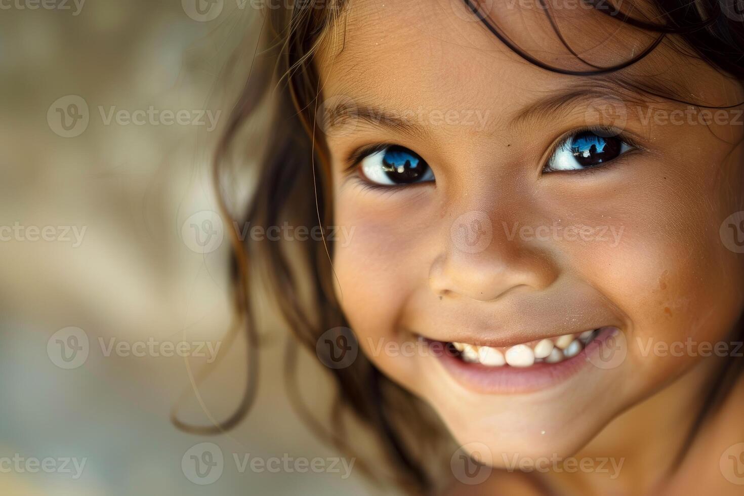 Radiant child with captivating blue eyes photo