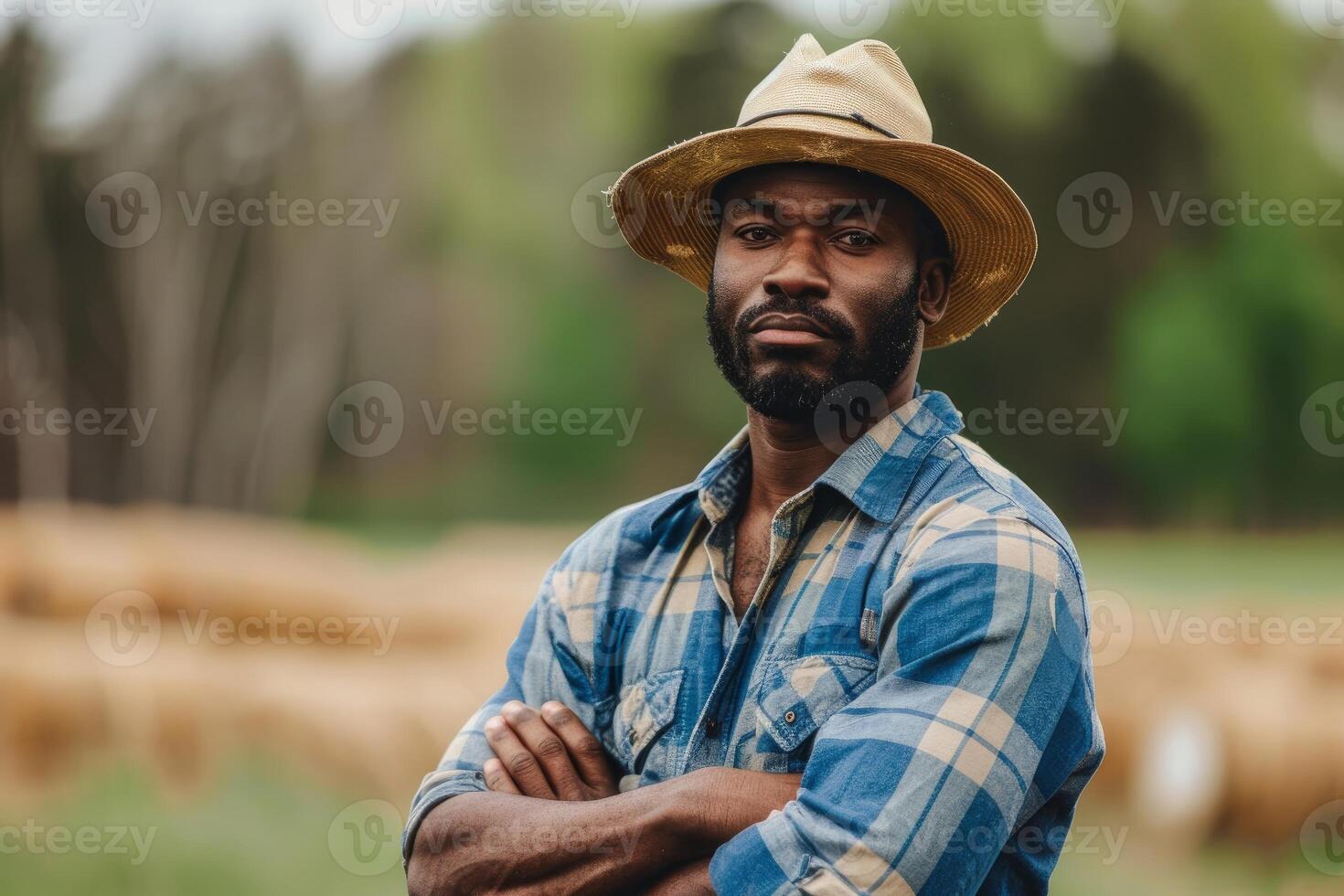 Confident farmer in hat outdoors photo