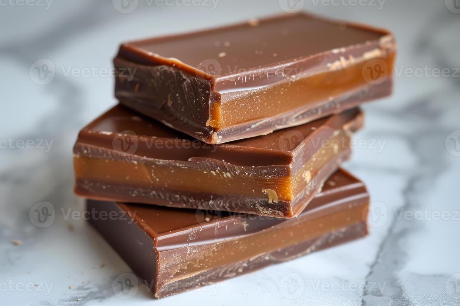 Stacked milk chocolate bars on marble photo
