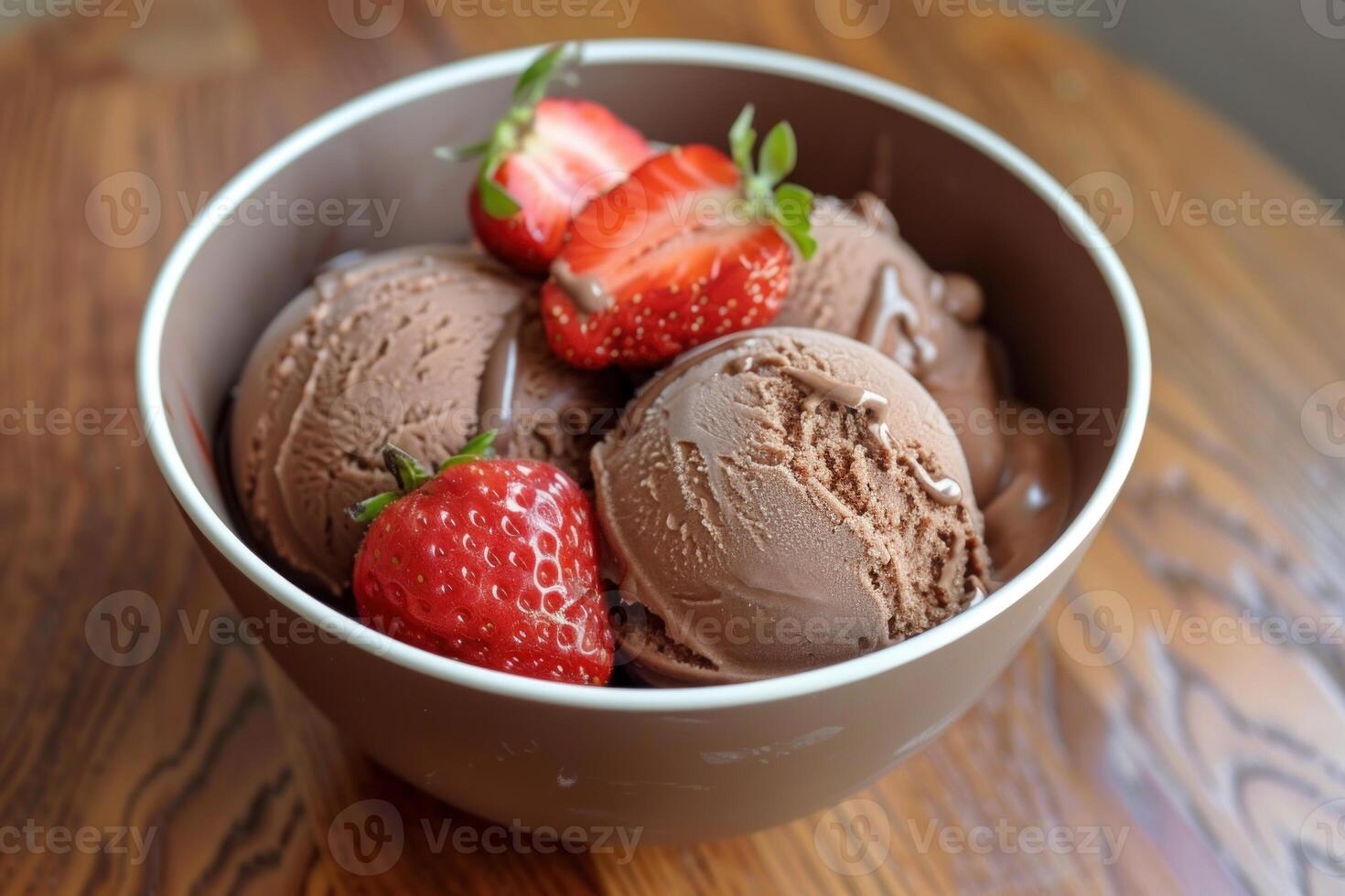 Chocolate ice cream with fresh strawberries in bowl photo