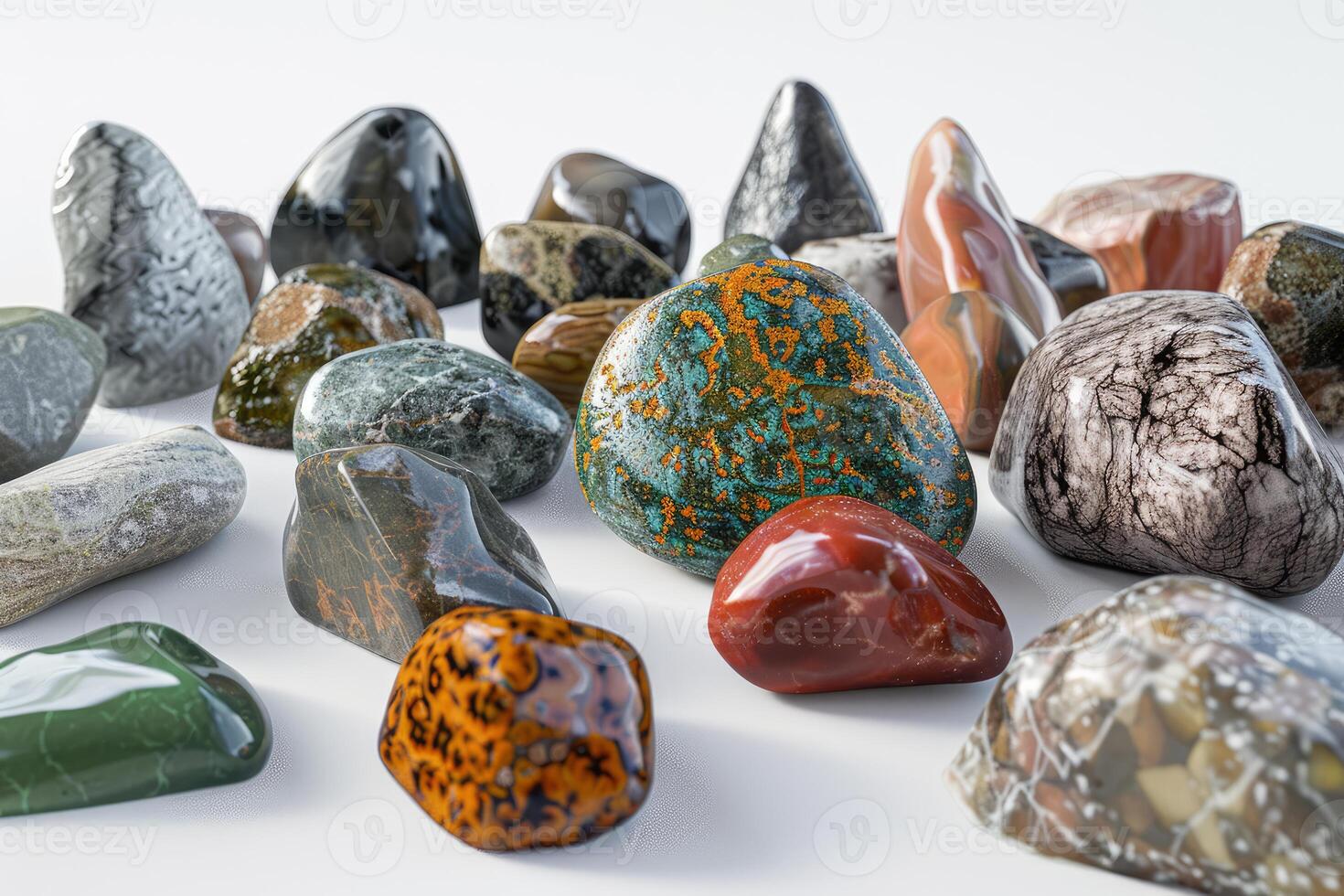 Variety of colorful polished gemstones on a white background photo