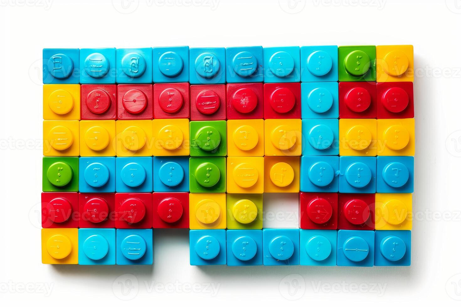 Colorful plastic building blocks arranged on white background photo