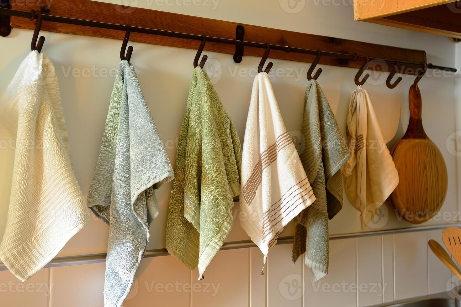 Kitchen towels hanging on hooks photo