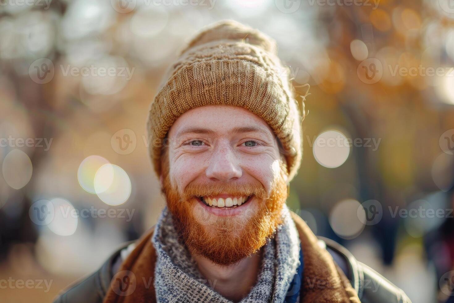 Cheerful man smiling with autumn backdrop photo