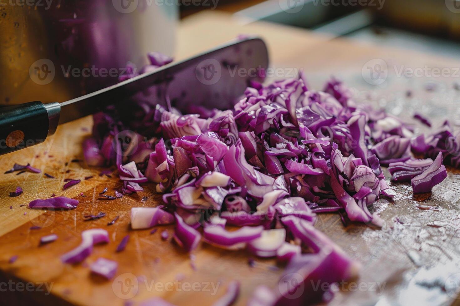 Chopped purple cabbage on wooden cutting board photo