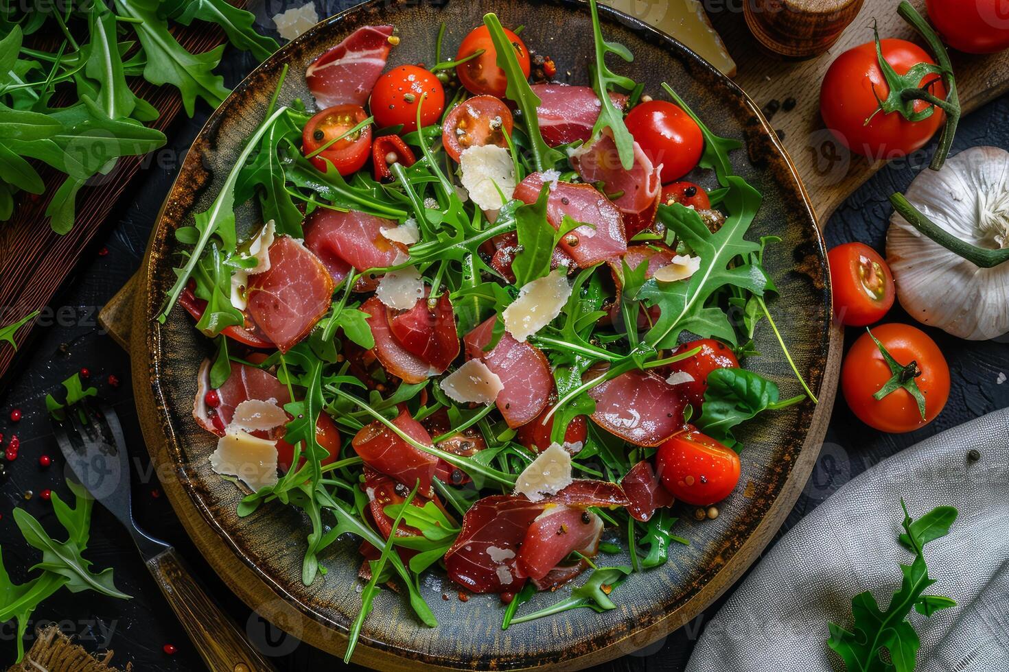 Fresh arugula and prosciutto salad with parmesan photo