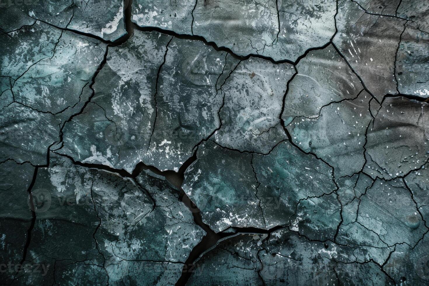 Cracked earth texture with moody blue tones photo