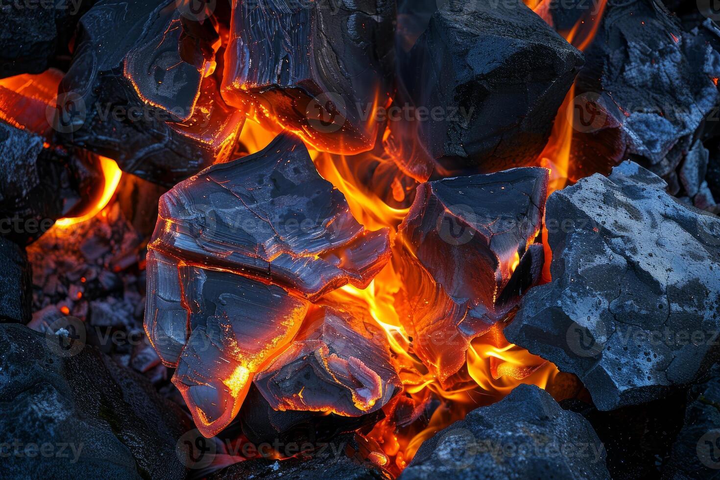 Highresolution image of hot charcoal embers glowing in a dark environment photo