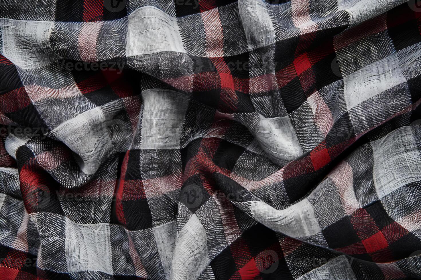 Red, black and white checkered fabric background with textured surface photo