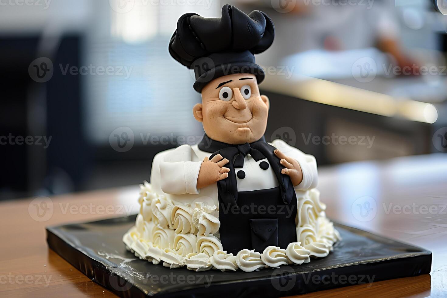 Cake decorated with smiling chef figure wearing toque and black tie photo