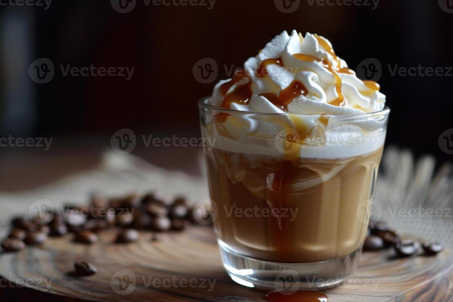 Caramel dripping on delicious whipped coffee with coffee beans scattered around photo