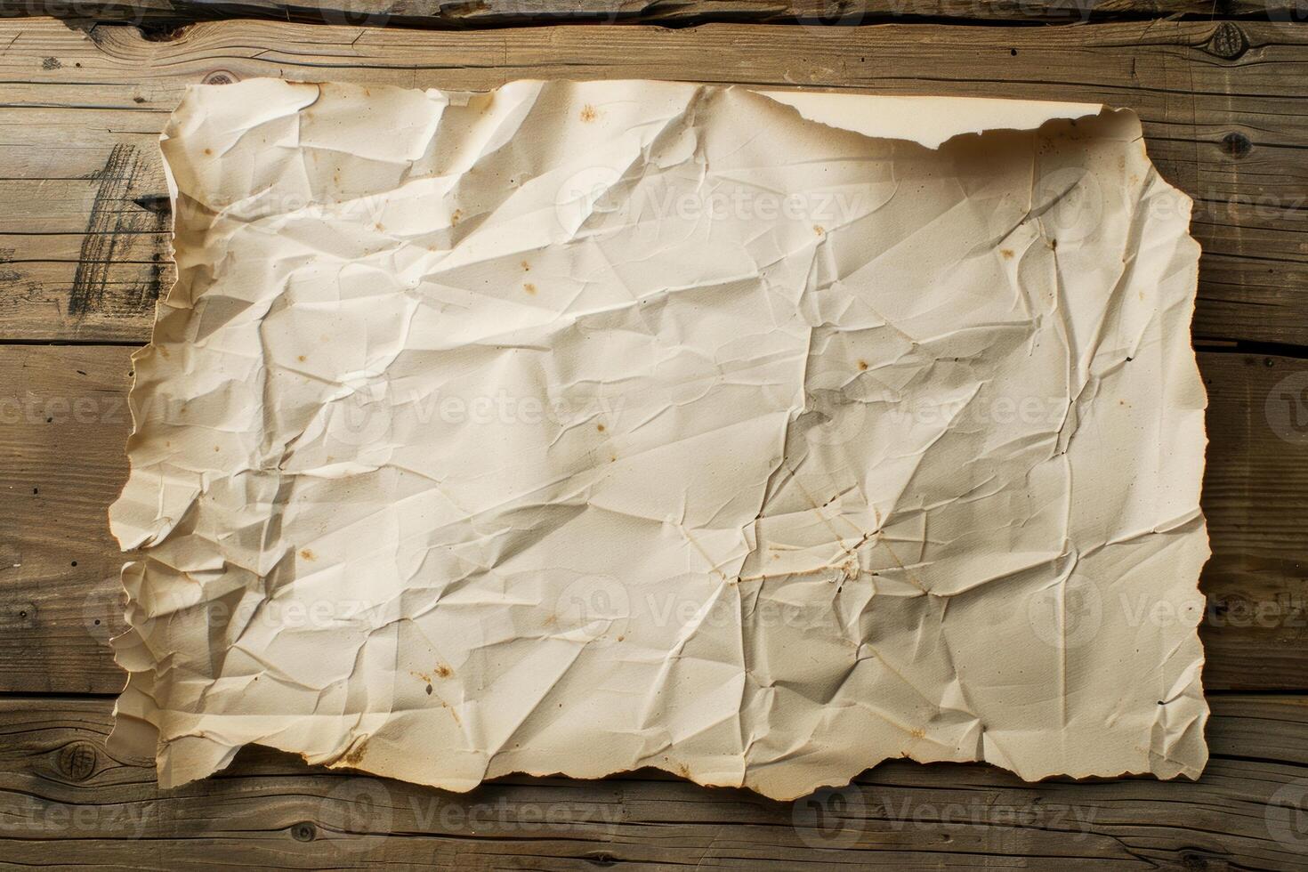 Crumpled paper is lying on a wooden surface with grain photo