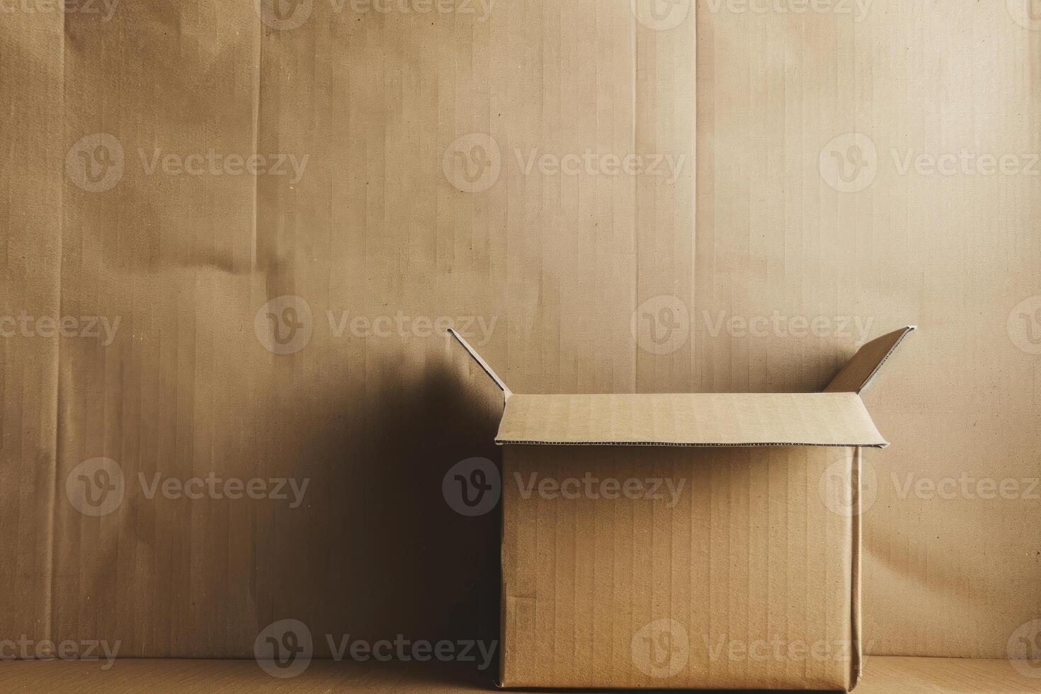 Empty cardboard box open on table with brown background photo