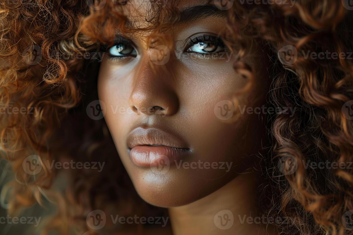 Beautiful black woman with afro hairstyle posing in a studio photo