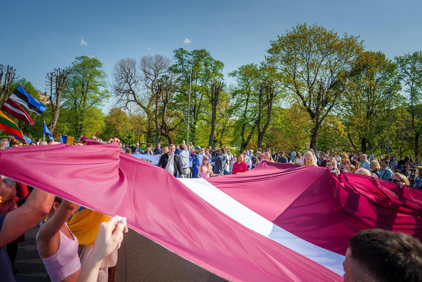 Vibrant Crowd Celebrating in Riga, Latvia A Festival of National Pride and Unity photo