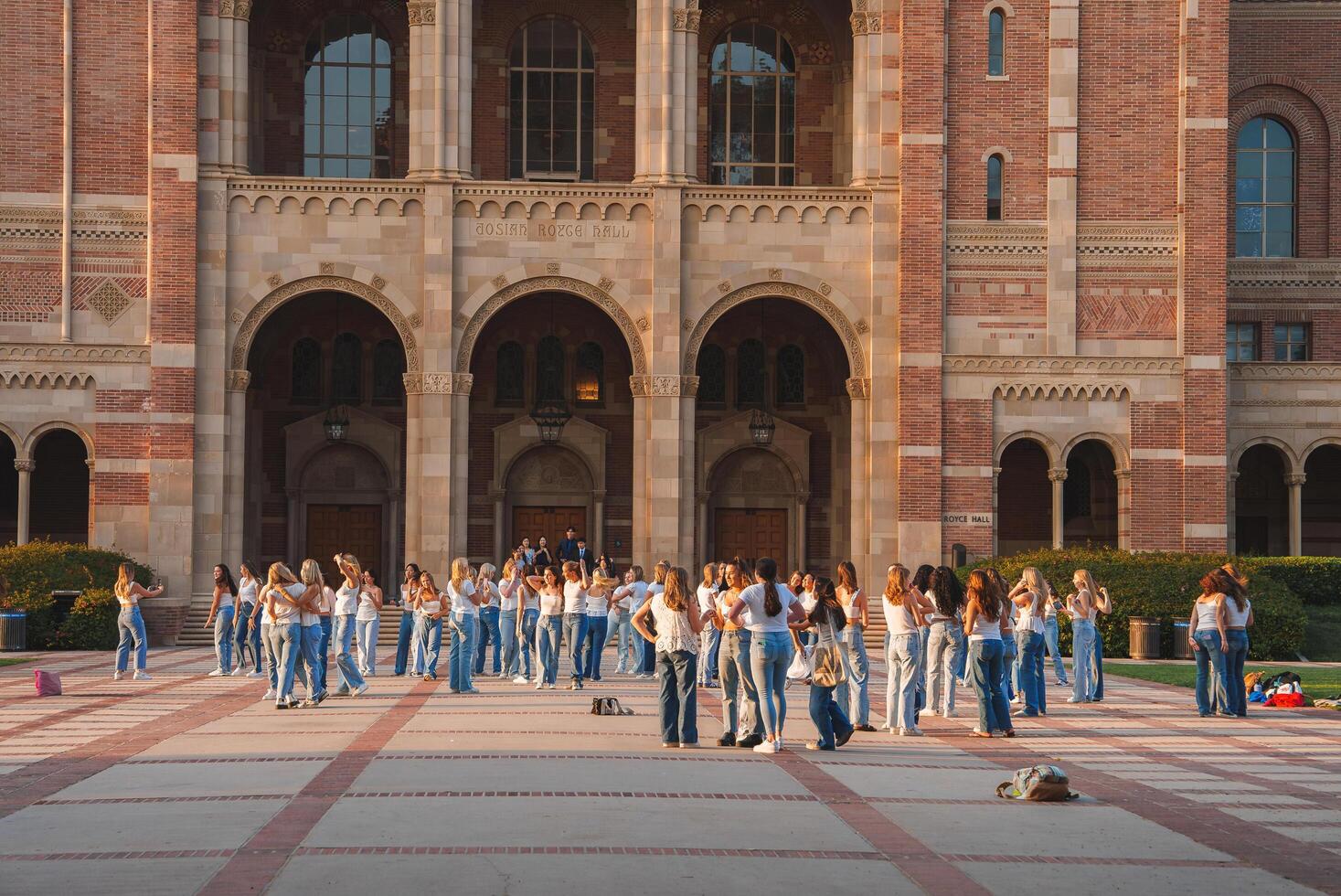 Historical Building Gathering, Denim and White, Group Activity, Outdoors photo