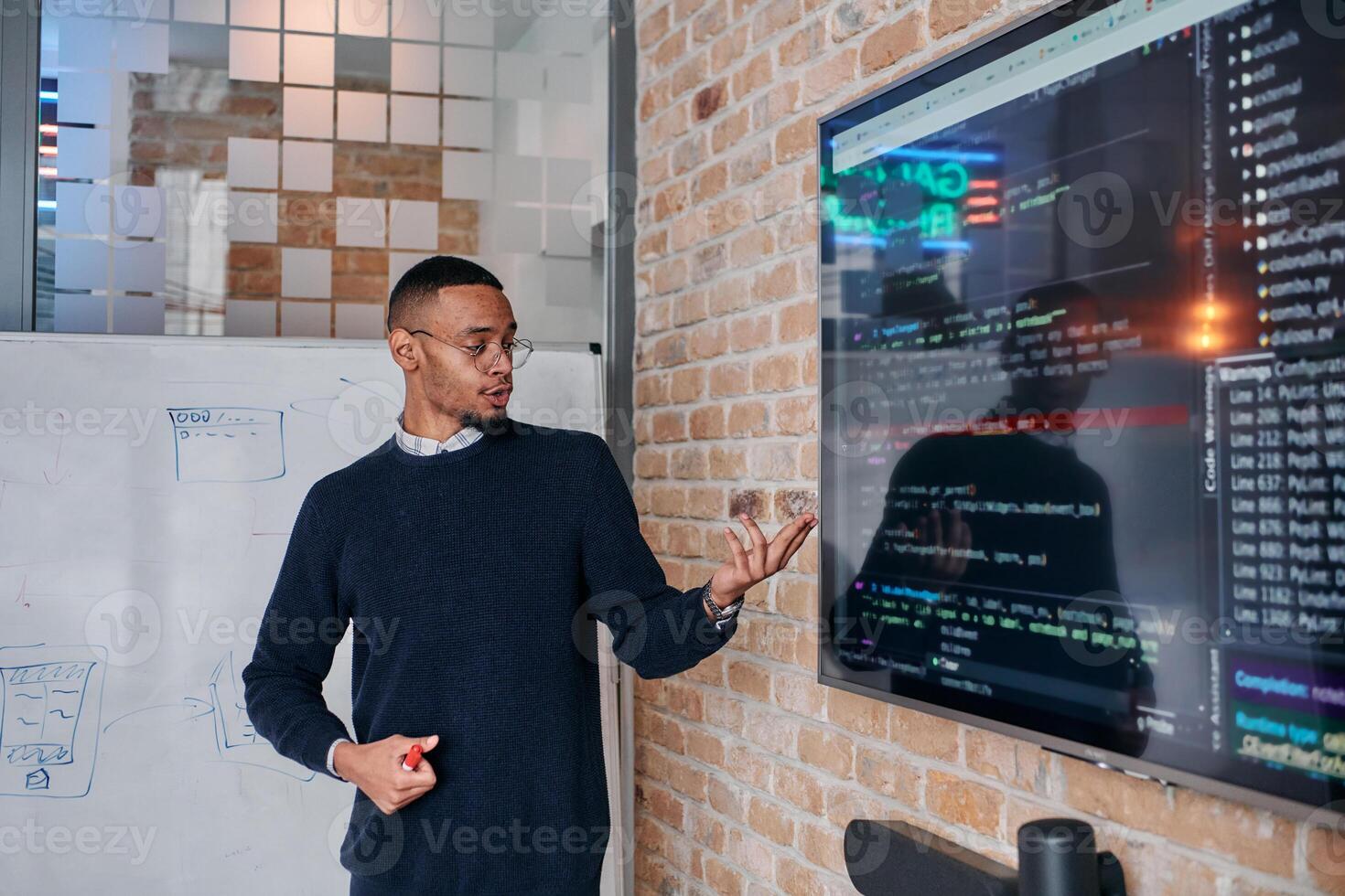 African American businessman delivers a compelling presentation of his business strategy to his colleagues, fostering collaboration and forward thinking photo