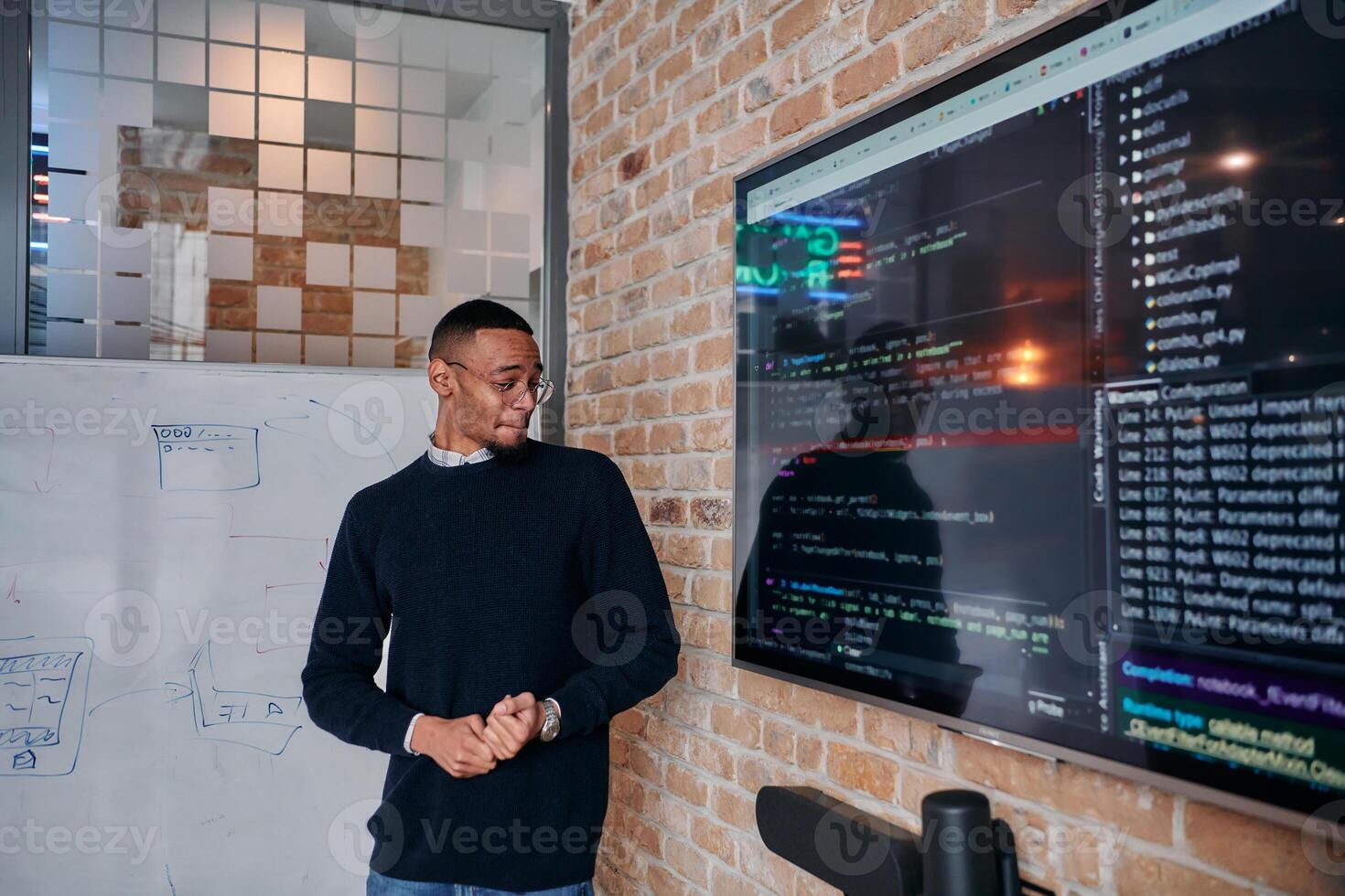 African American businessman delivers a compelling presentation of his business strategy to his colleagues, fostering collaboration and forward thinking photo