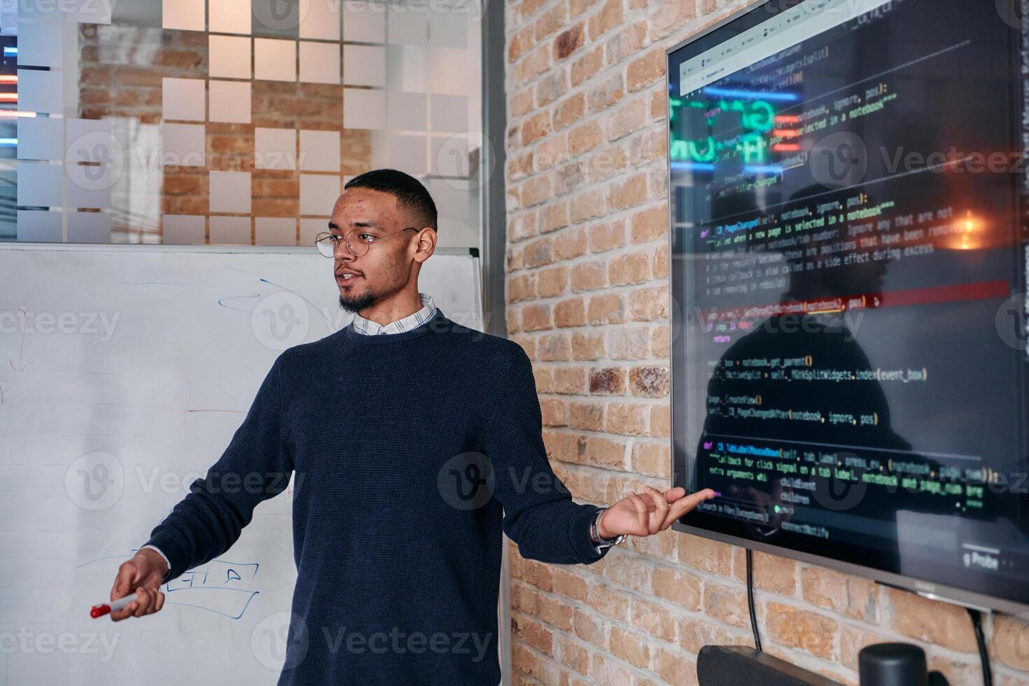 African American businessman delivers a compelling presentation of his business strategy to his colleagues, fostering collaboration and forward thinking photo
