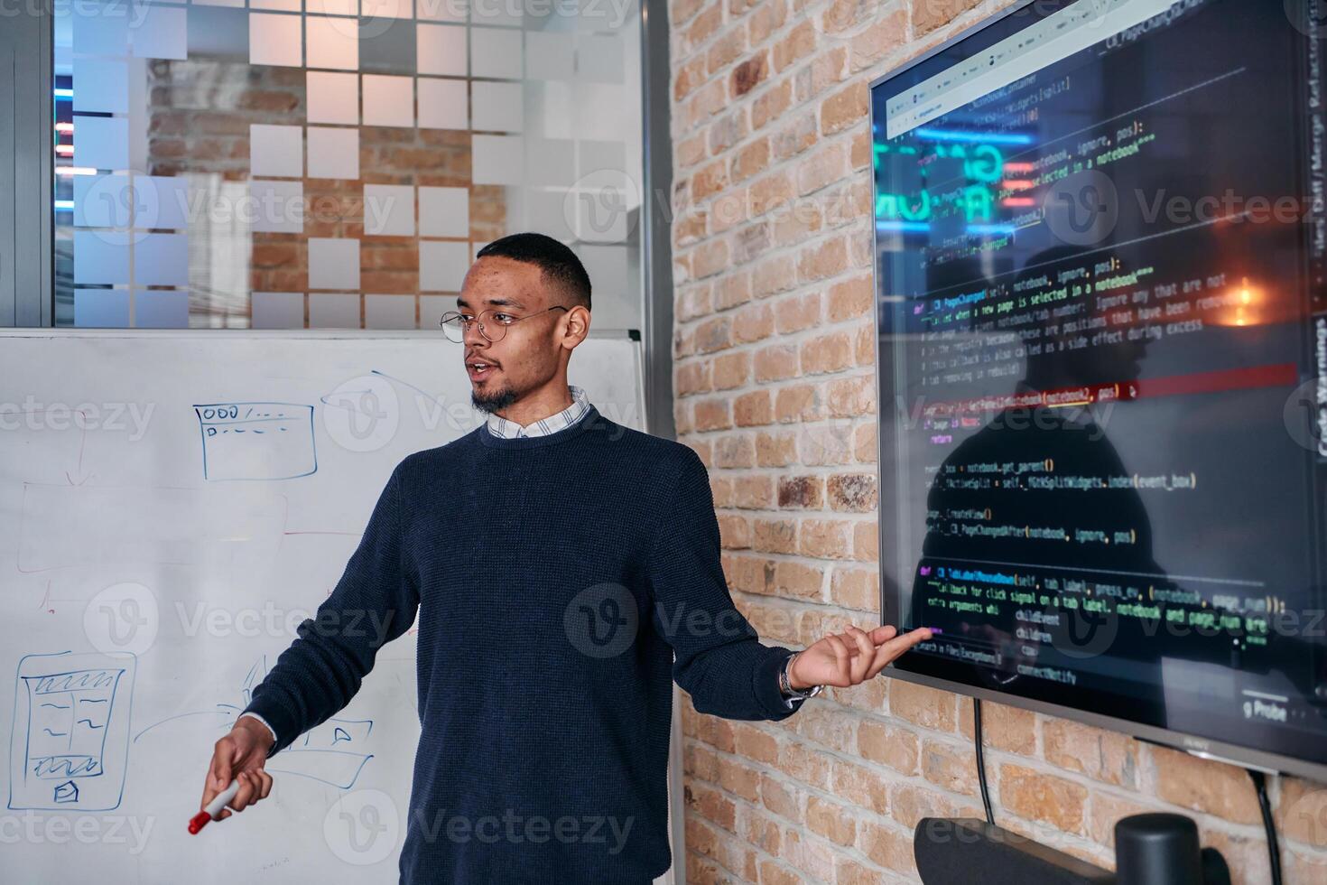 African American businessman delivers a compelling presentation of his business strategy to his colleagues, fostering collaboration and forward thinking photo