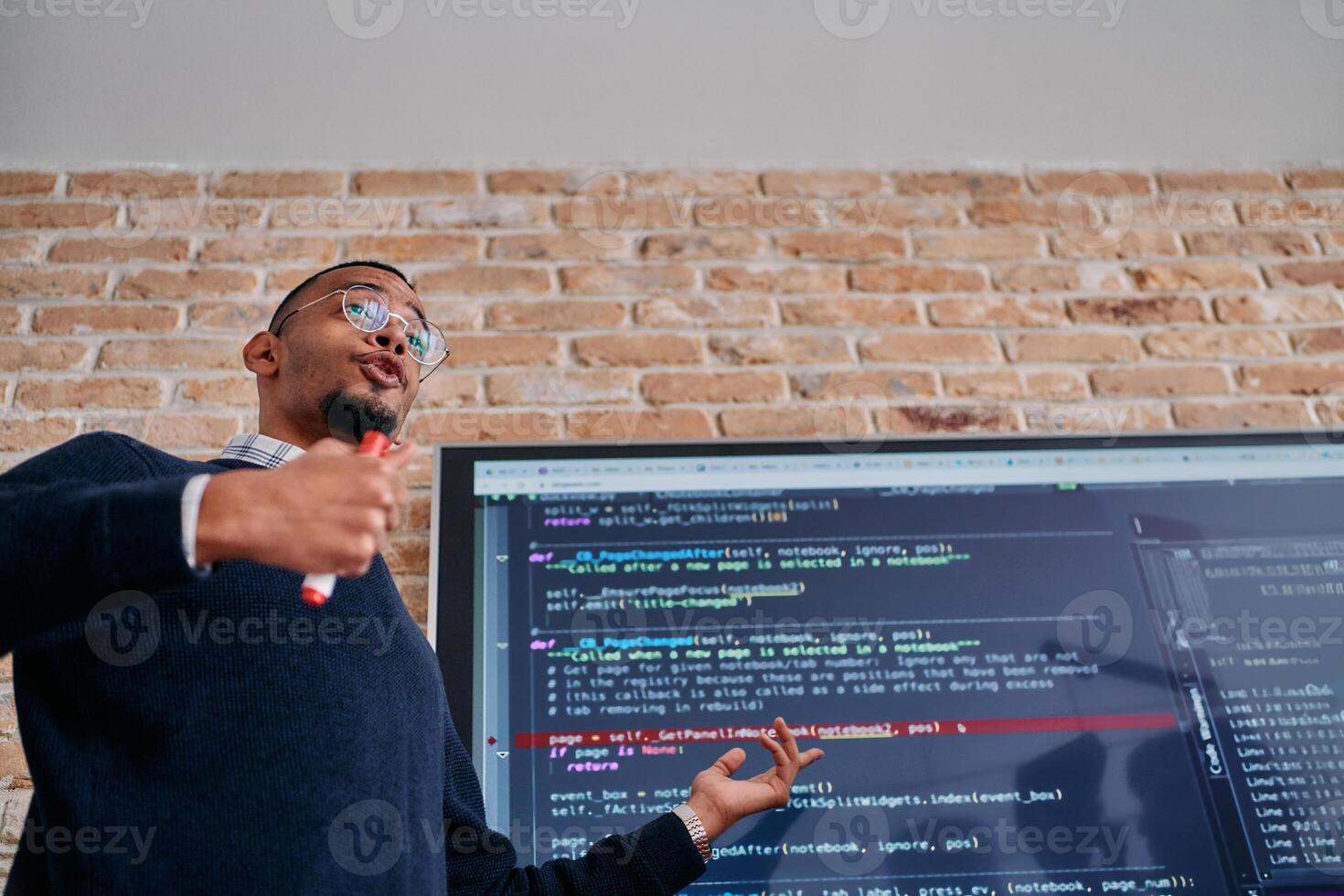 African American businessman delivers a compelling presentation of his business strategy to his colleagues, fostering collaboration and forward thinking photo
