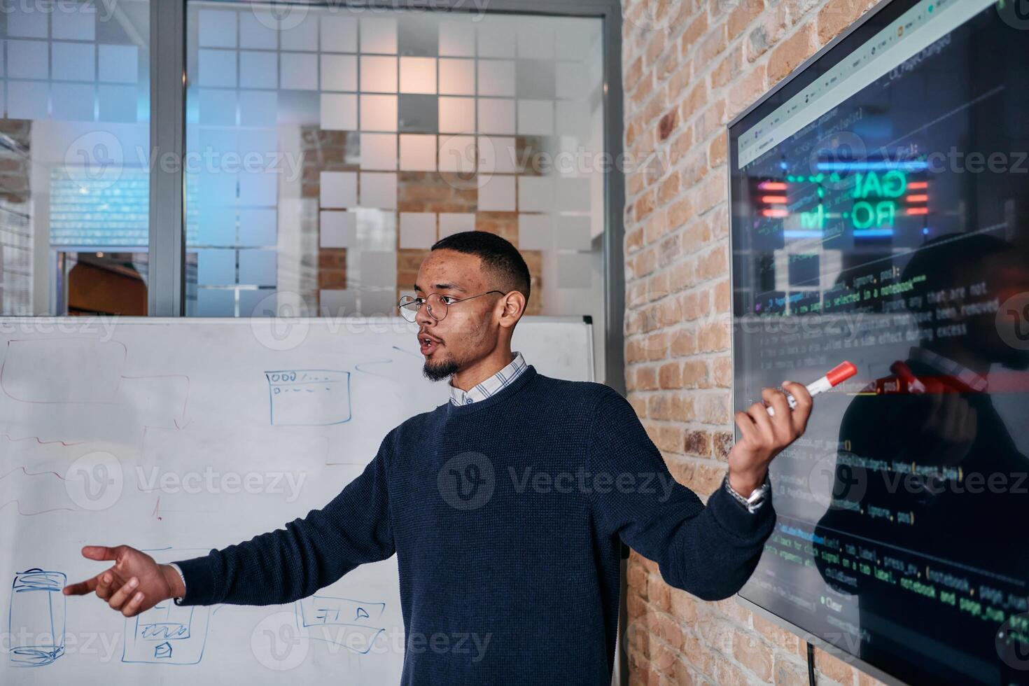 African American businessman delivers a compelling presentation of his business strategy to his colleagues, fostering collaboration and forward thinking photo