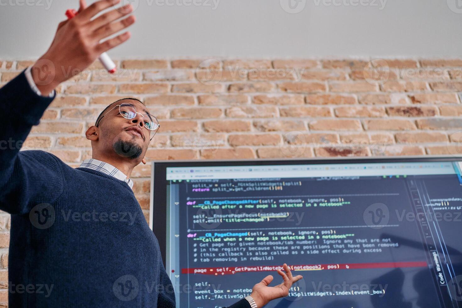 African American businessman delivers a compelling presentation of his business strategy to his colleagues, fostering collaboration and forward thinking photo