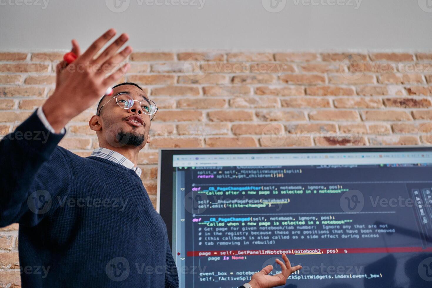 African American businessman delivers a compelling presentation of his business strategy to his colleagues, fostering collaboration and forward thinking photo