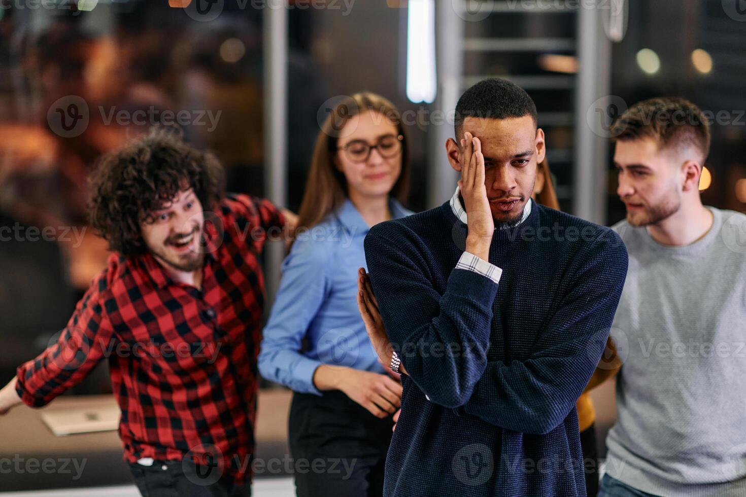 A group of young business people have fun playing interesting games while taking a break from work in a modern office. Selective focus photo
