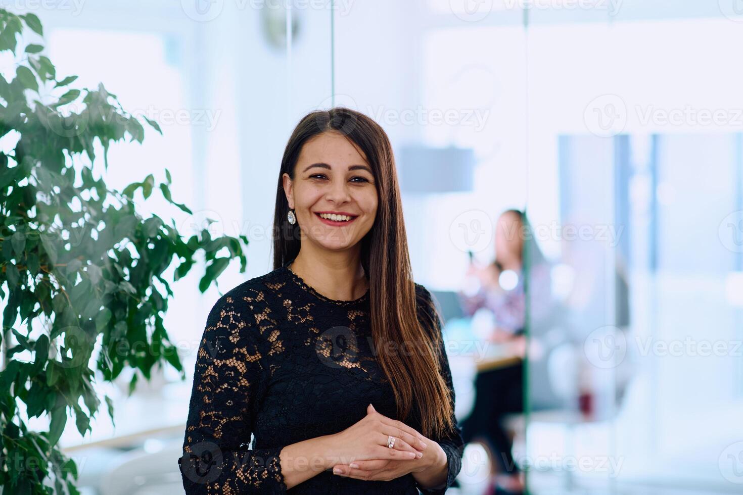 Portrait of a Confident Businesswoman with Crossed Arms in Her Office Environment. photo