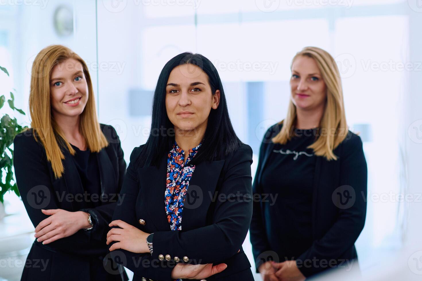 Group of Businesswomen in Modern Office Setting. photo