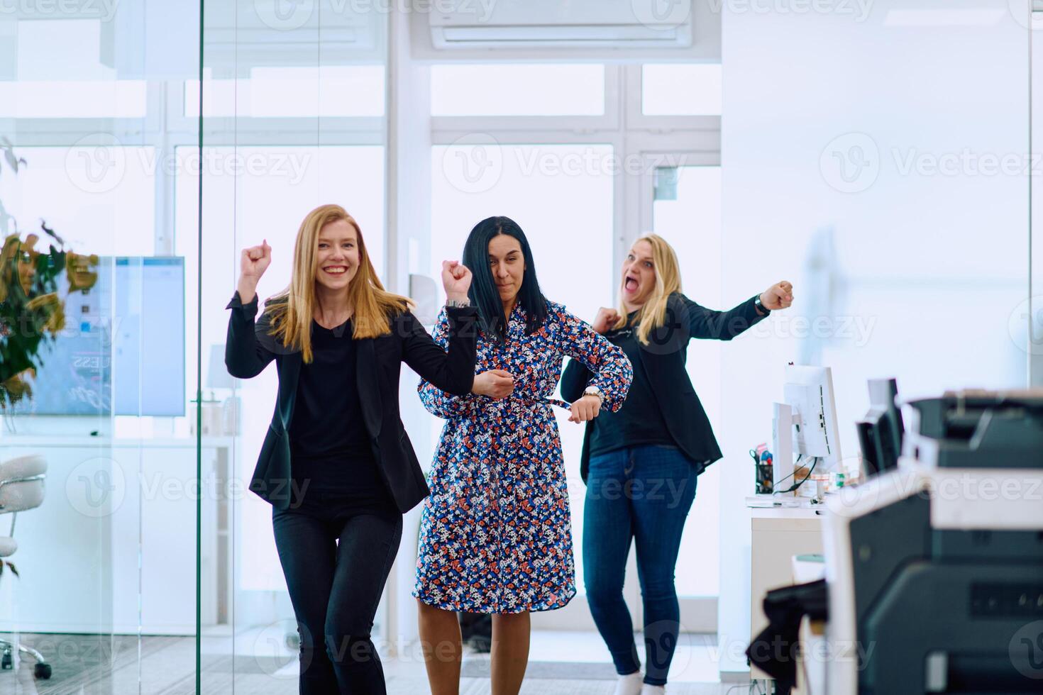 Dynamic Businesswomen. Spreading Joy and Energy Through Office Dance photo