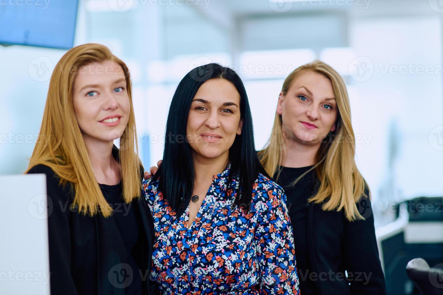 Group of Businesswomen in Modern Office Setting. photo
