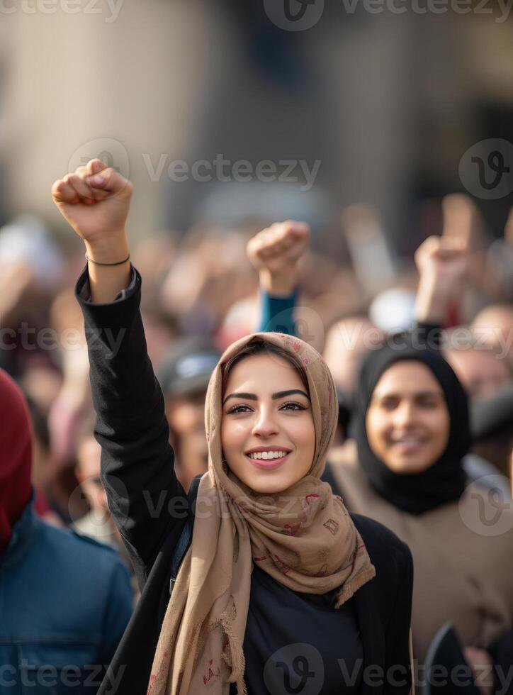 A group of Muslim women wearing hijabs is captured in a demonstration, symbolizing their collective struggle and advocacy for the rights of Muslims worldwide, emphasizing themes of photo