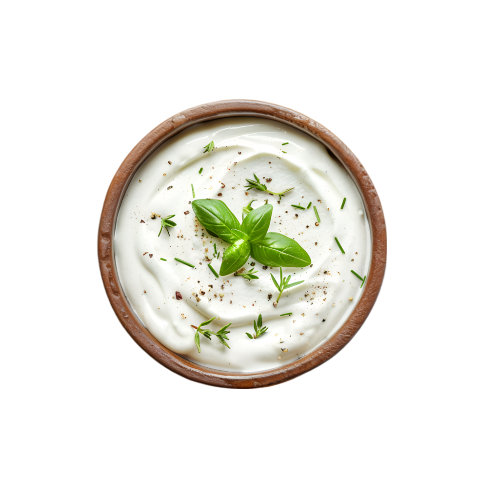 Herb garnish on creamy sauce in wooden bowl isolated on a transparent background png
